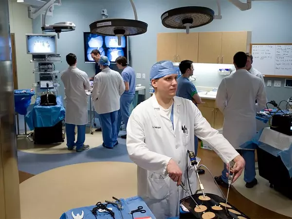Doctors training in mock operating room.