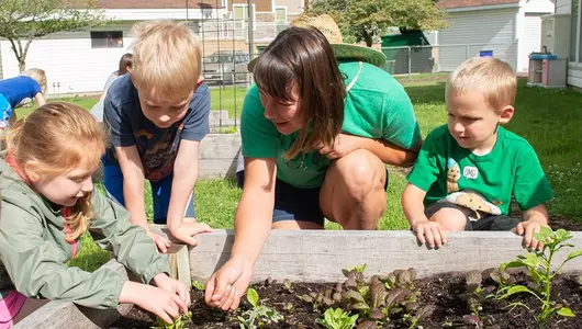 Linda Vale of GROW La Crosse with children from the Gundersen Child Care Center.