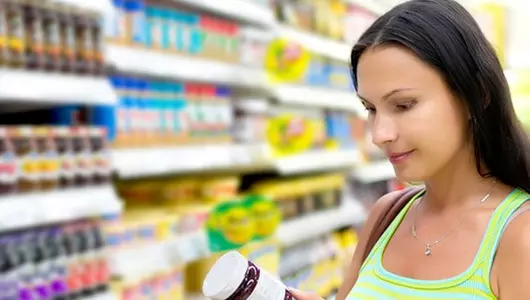 woman looking at food label