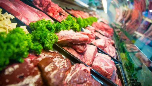 Red meat in grocery display case