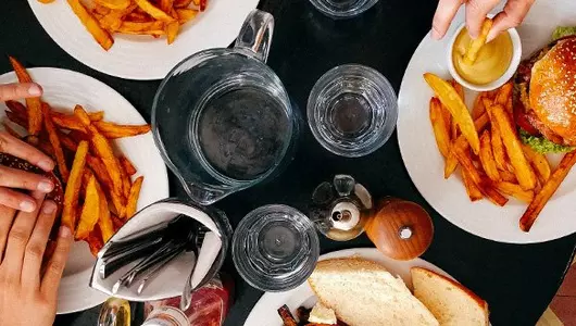 restaurant table full of plates of food