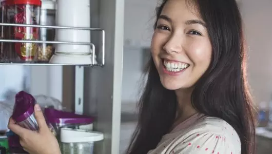 woman opening her cupboard