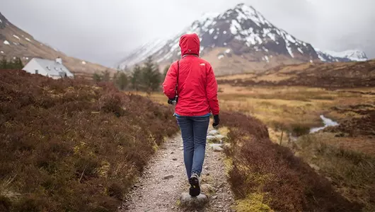 woman walking near mountain