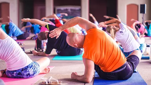 group of people doing yoga