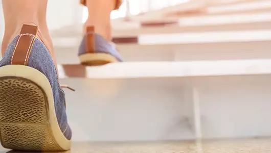 woman walking up stairs