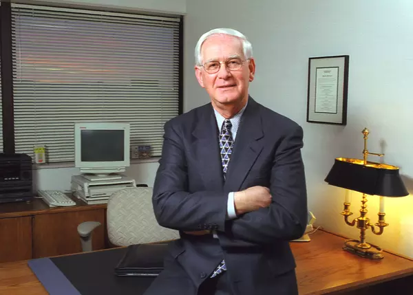 Portrait of healthcare businessman in late 1990s office.