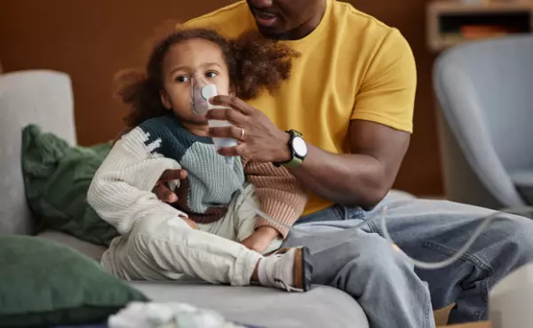 toddler with RSV and nebulizer